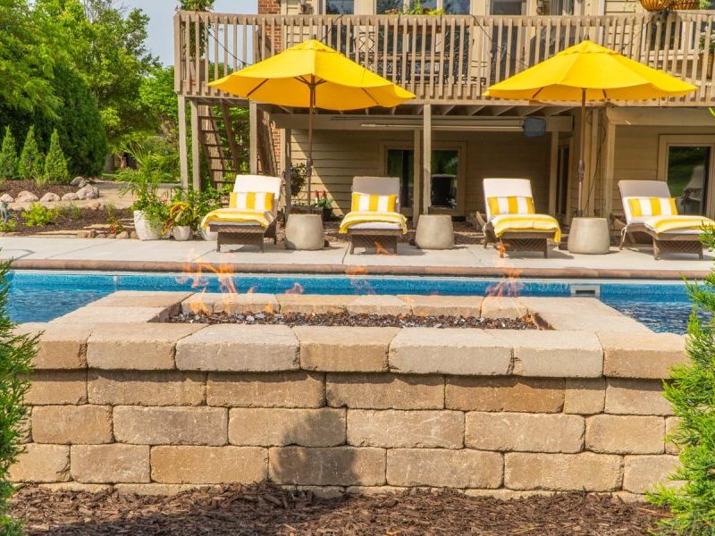 Fire pit and outdoor living space transformation in Merrillville, Indiana by Dean's Pools and Landscaping