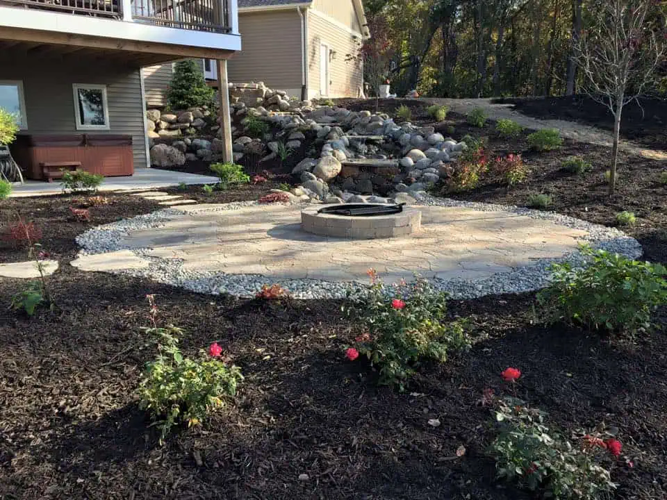 Elegant hardscape design featuring a blend of stone and greenery for outdoor aesthetics.