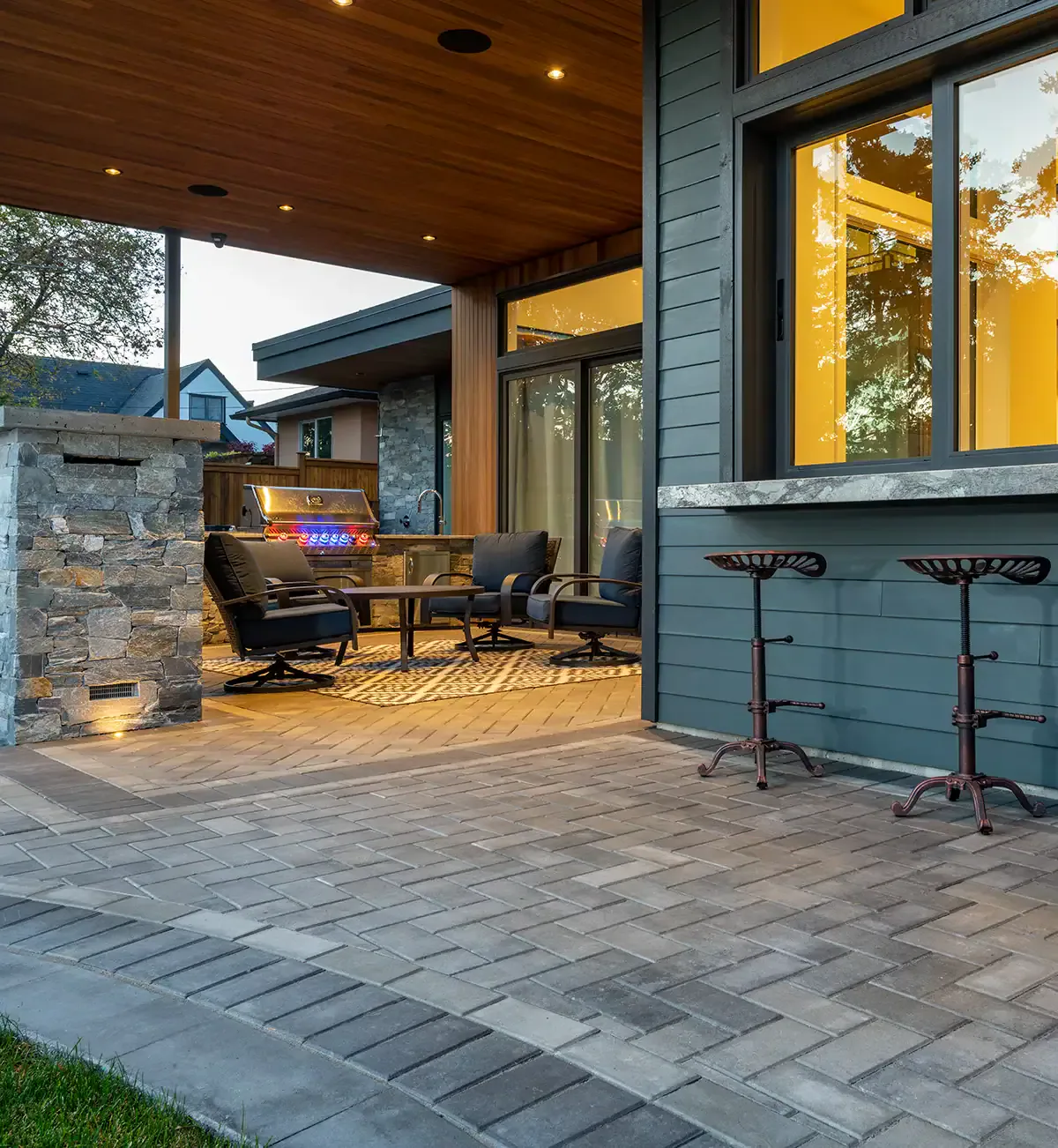Inviting outdoor kitchen space designed for cooking and entertaining in a backyard oasis.