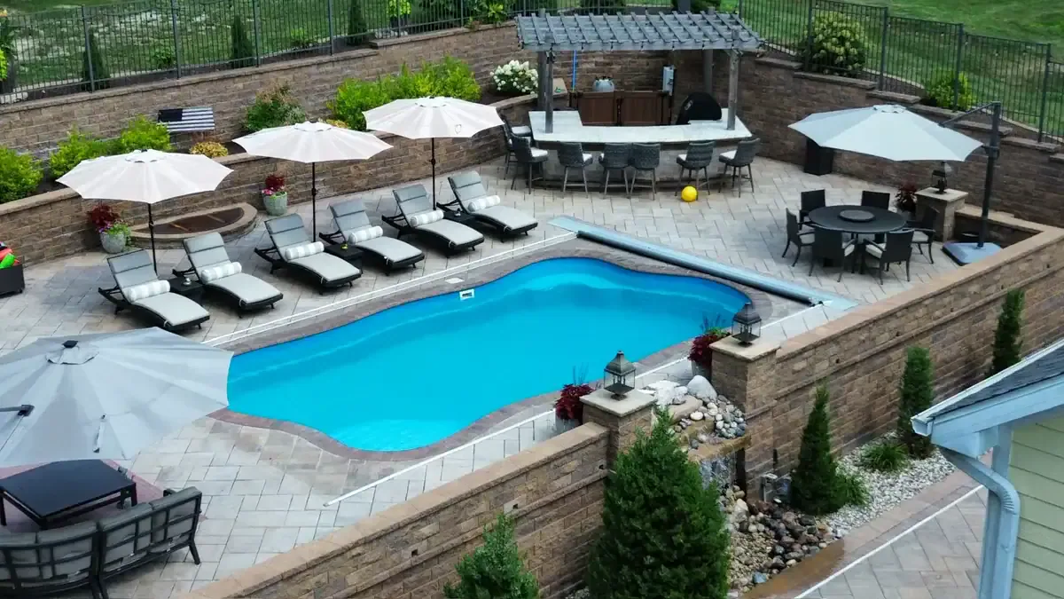 Backyard pool and landscaping concept by Dean’s Pools and Landscaping Northwest Indiana